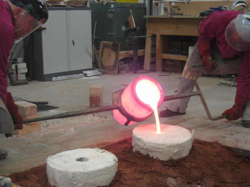 pouring bronze in the foundry at Chelsea College of Art and Design